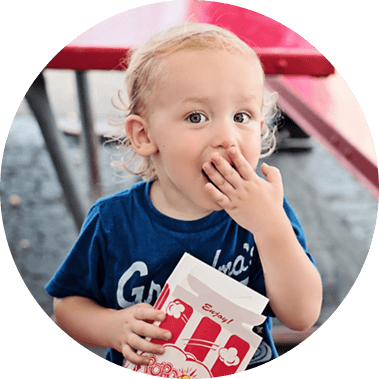 Young child eating popcorn