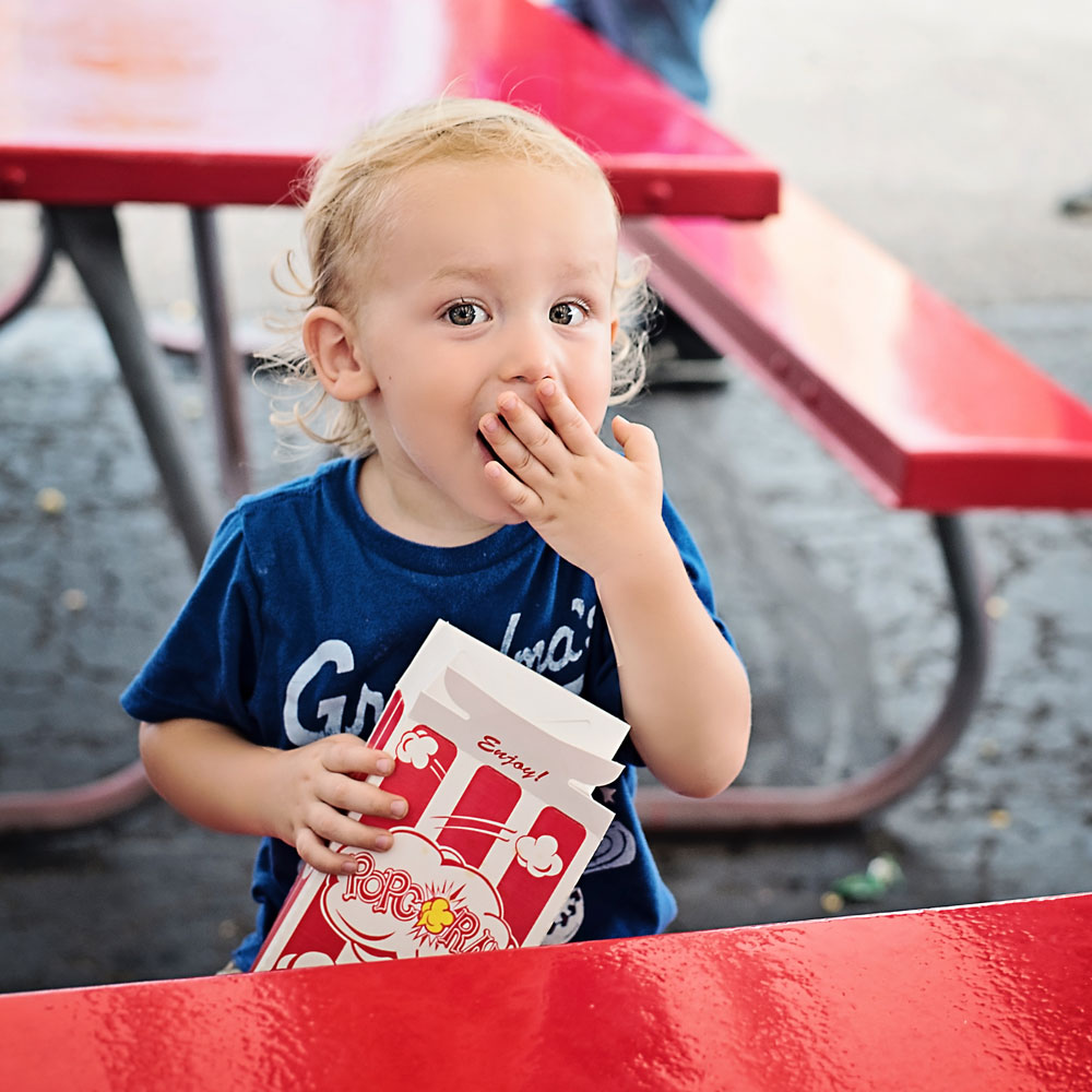 Young child eating popcorn